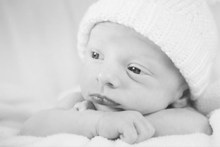 Awake newborn photography pose - inspirations for taking your own baby photos. 